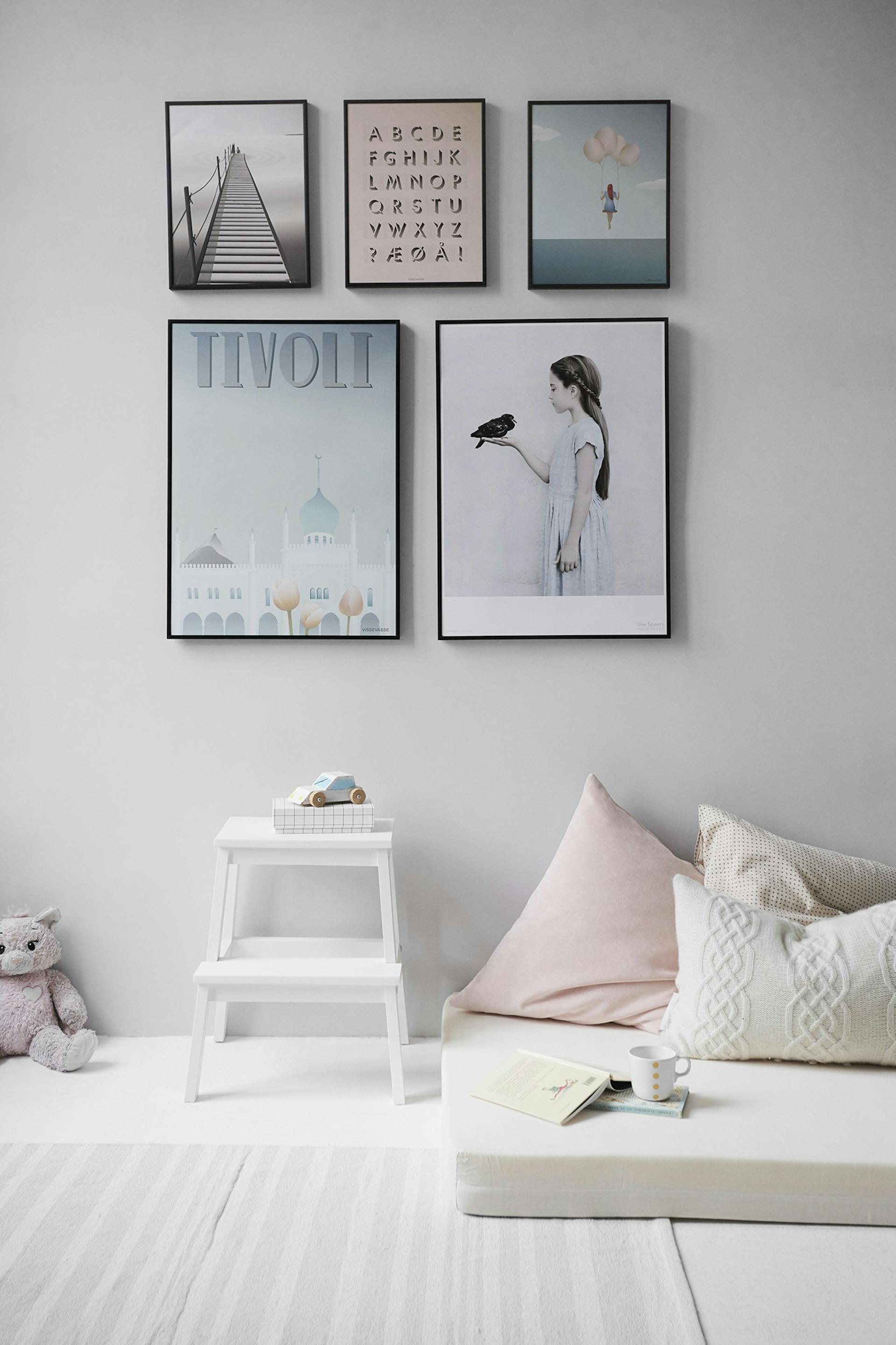 White shiplap accent wall in a living room with natural wood accents